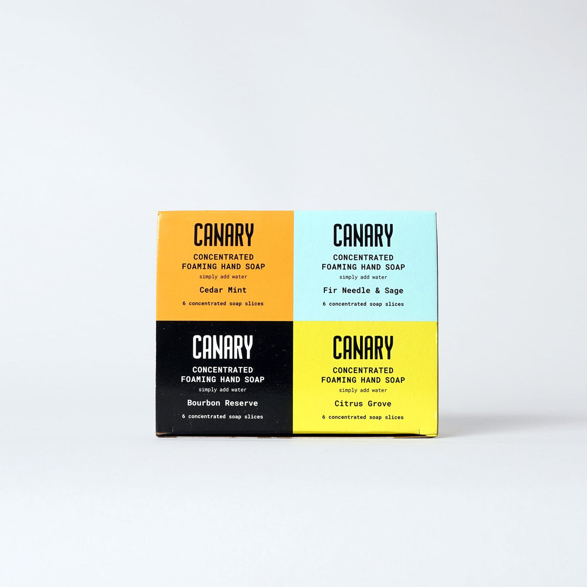 Four-scent concentrated hand soap refill bars in yellow, blue, black, and lime boxes