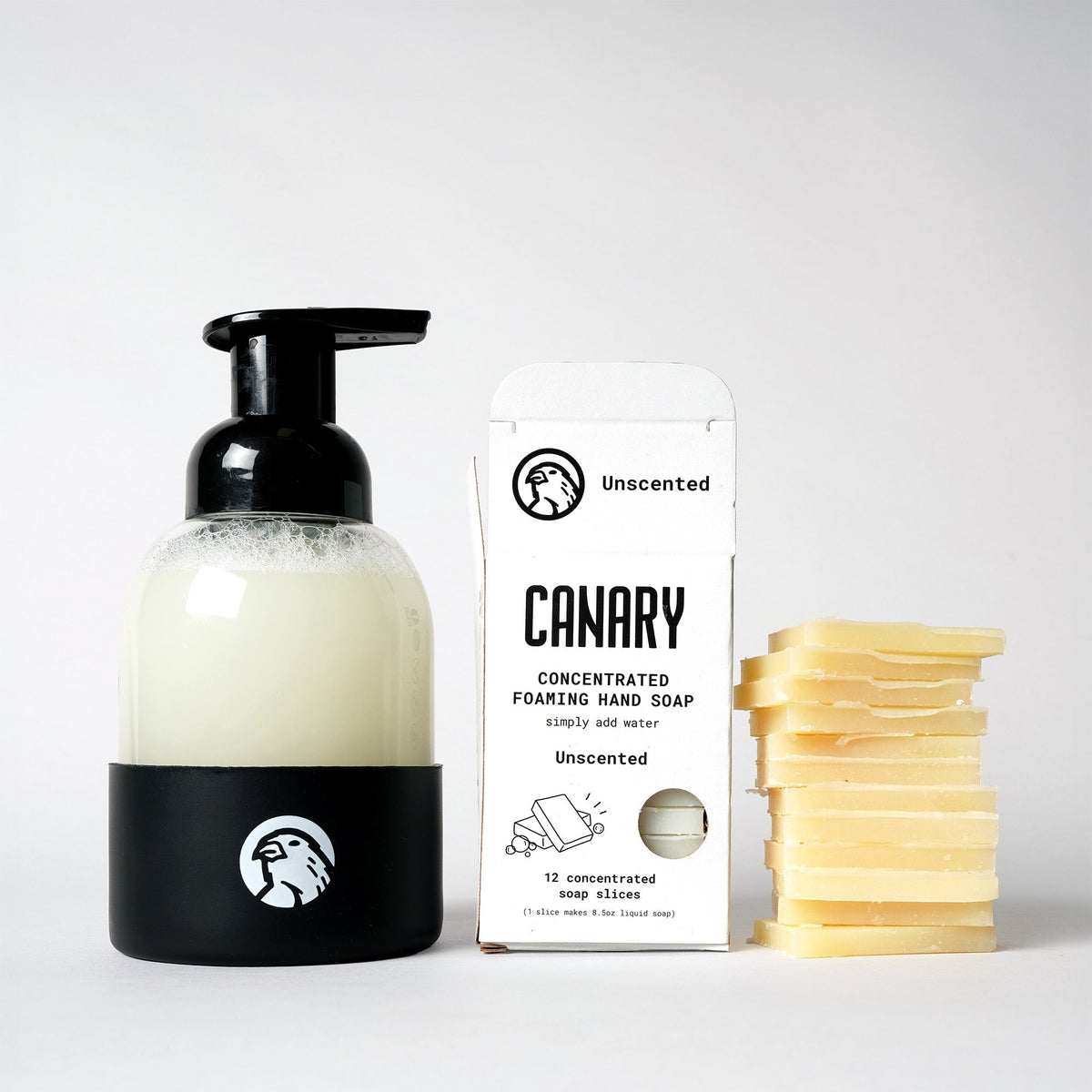 Foaming hand soap refill kit with black pump bottle, carton, and stacked pale soap slices