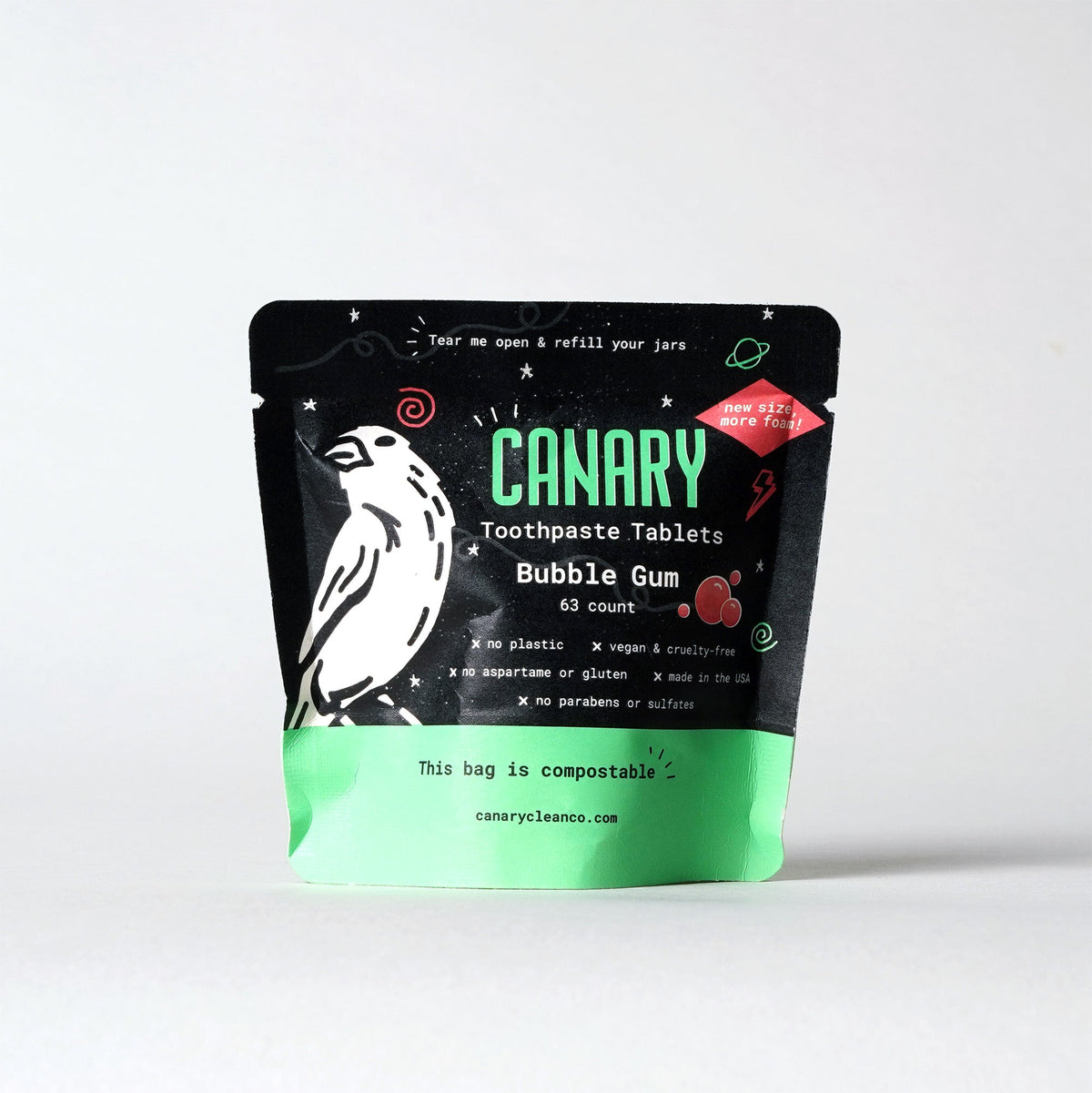 CANARY bubble gum toothpaste tablets in a black and green compostable pouch