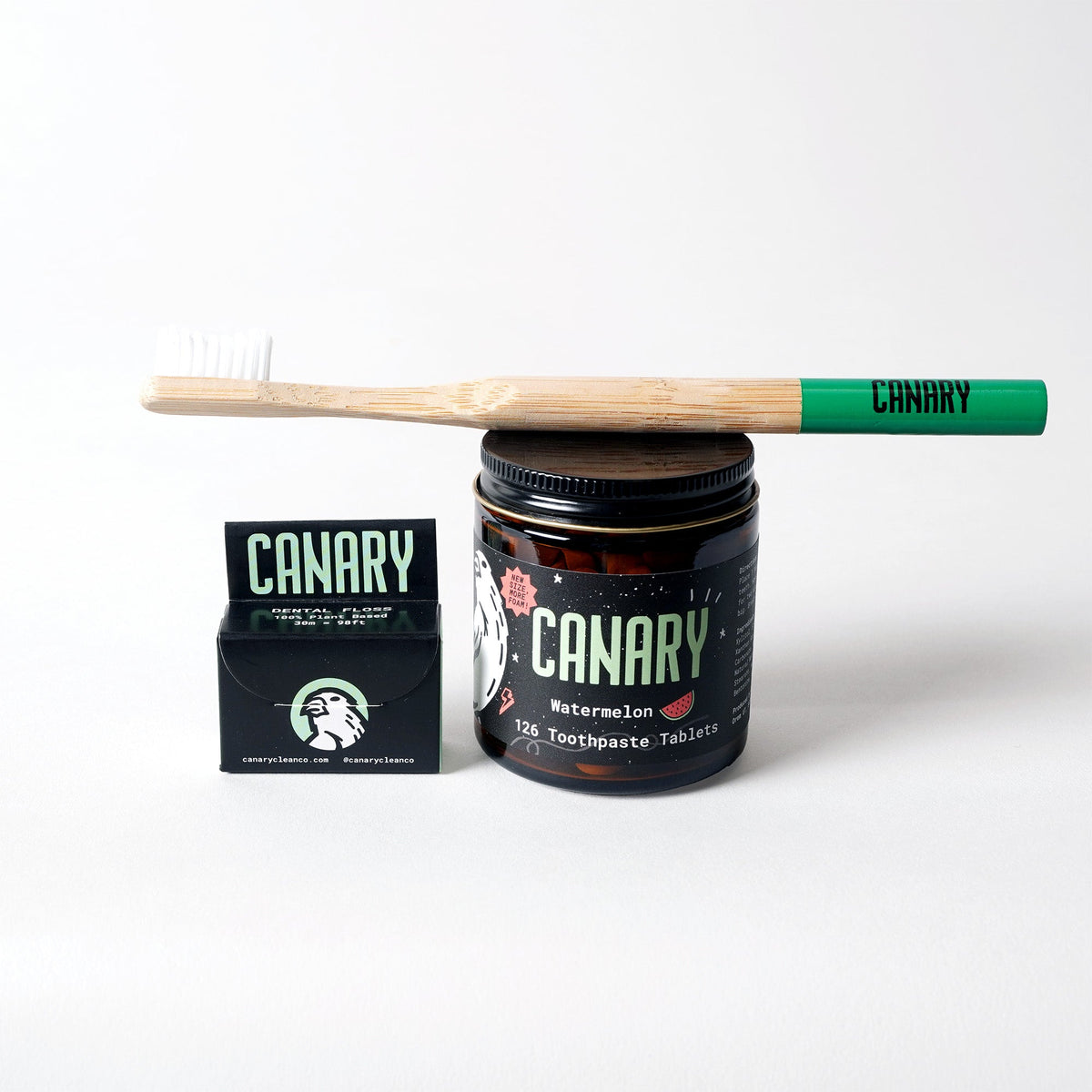 Oral care bundle with bamboo toothbrush, watermelon toothpaste tablets, and vegan dental floss