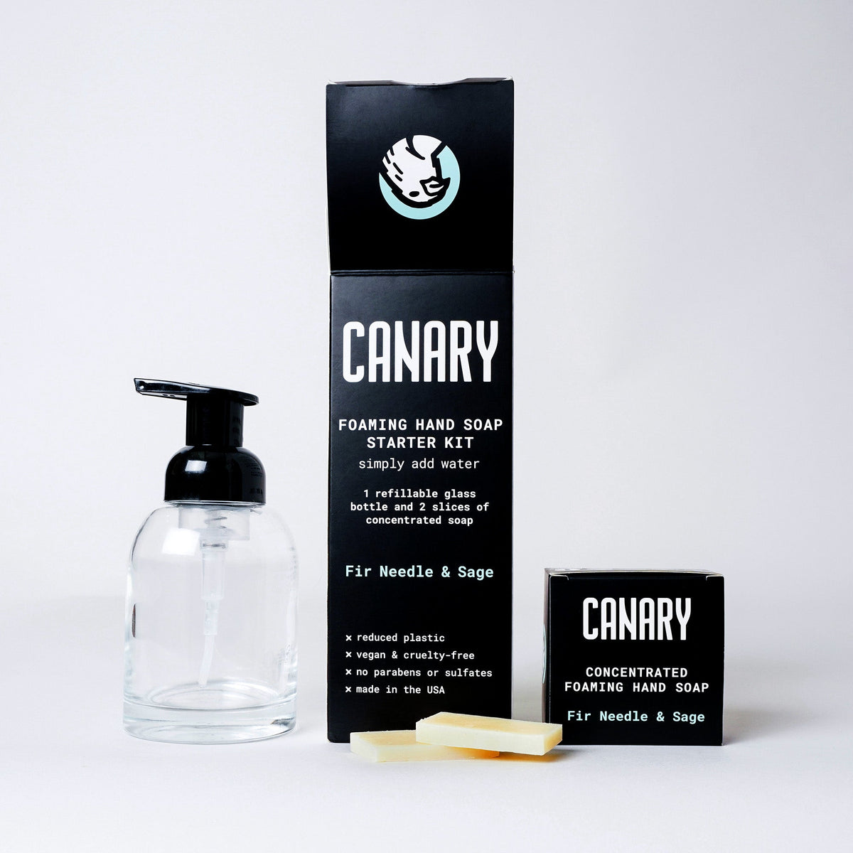 Canary hand soap starter kit with clear glass pump bottle, two soap slices and Fir Needle & Sage refills