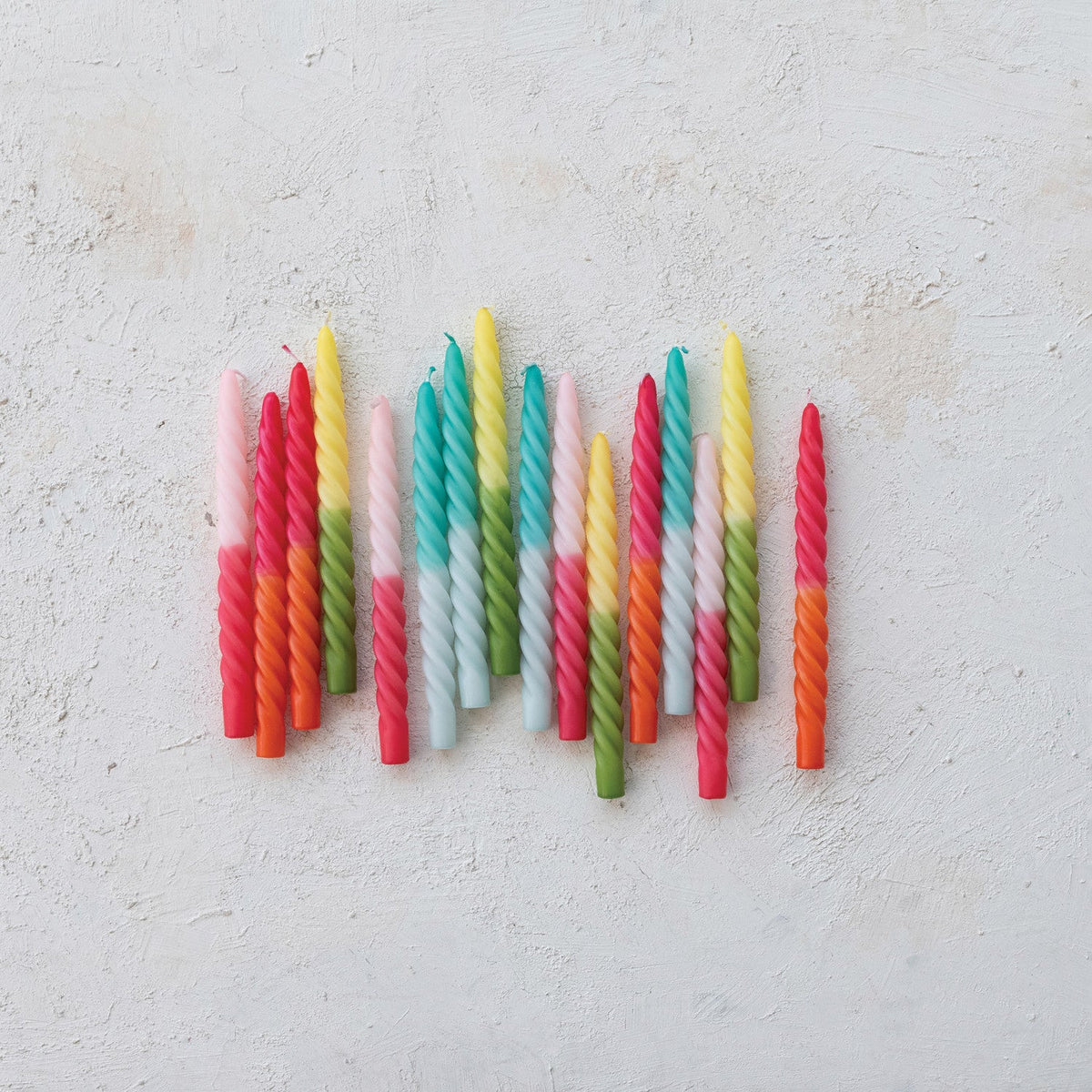 Twisted taper candles cluster with multicolor wax twists in various ombre shades
