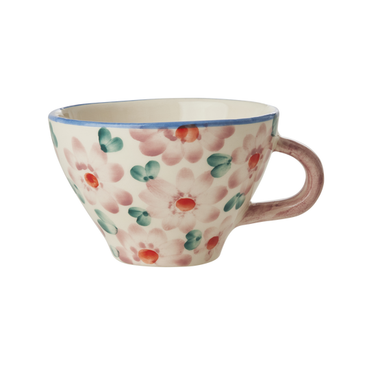 Ceramic tea cup with pink hand-painted floral pattern and curved side handle