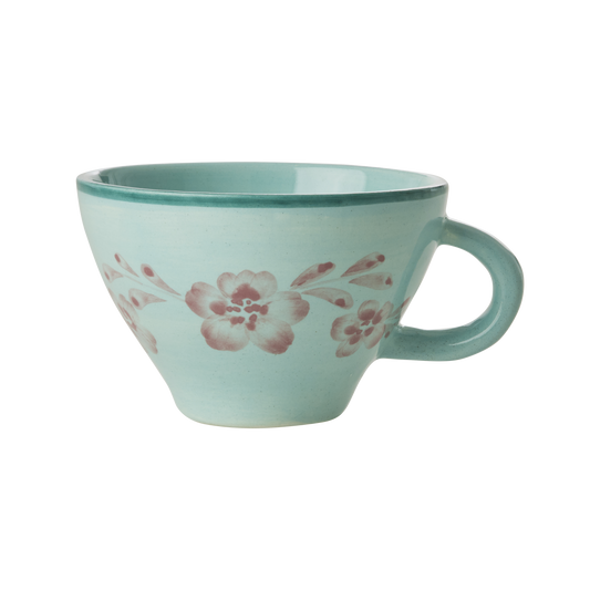 Ceramic tea cup with mint glaze and hand-painted soft pink floral vine, side handle