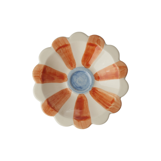 Flower-shaped ceramic dipping bowl with orange hand-painted stripe petals and blue center