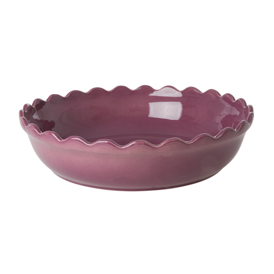 Purple round stoneware oven dish with scalloped rim