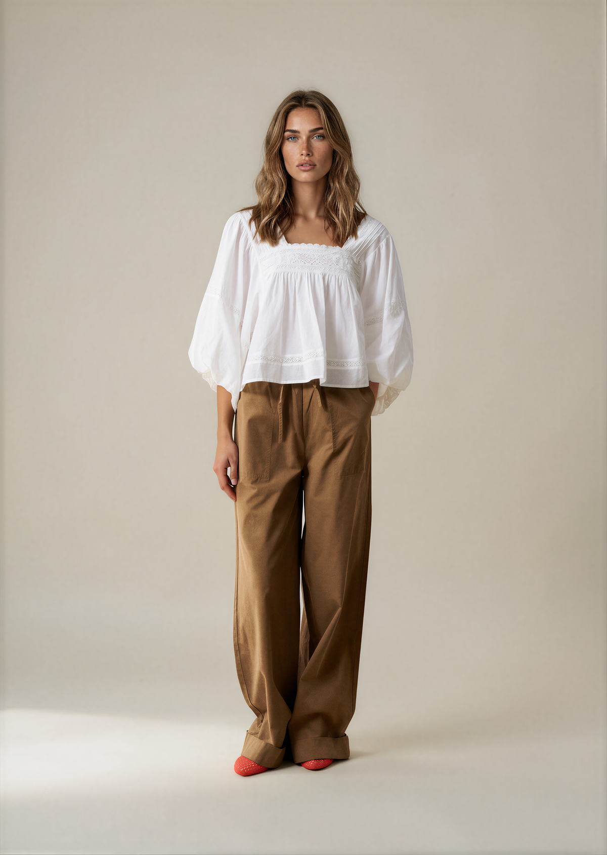 White puff sleeve blouse with lace neckline, loose fit and gathered waist