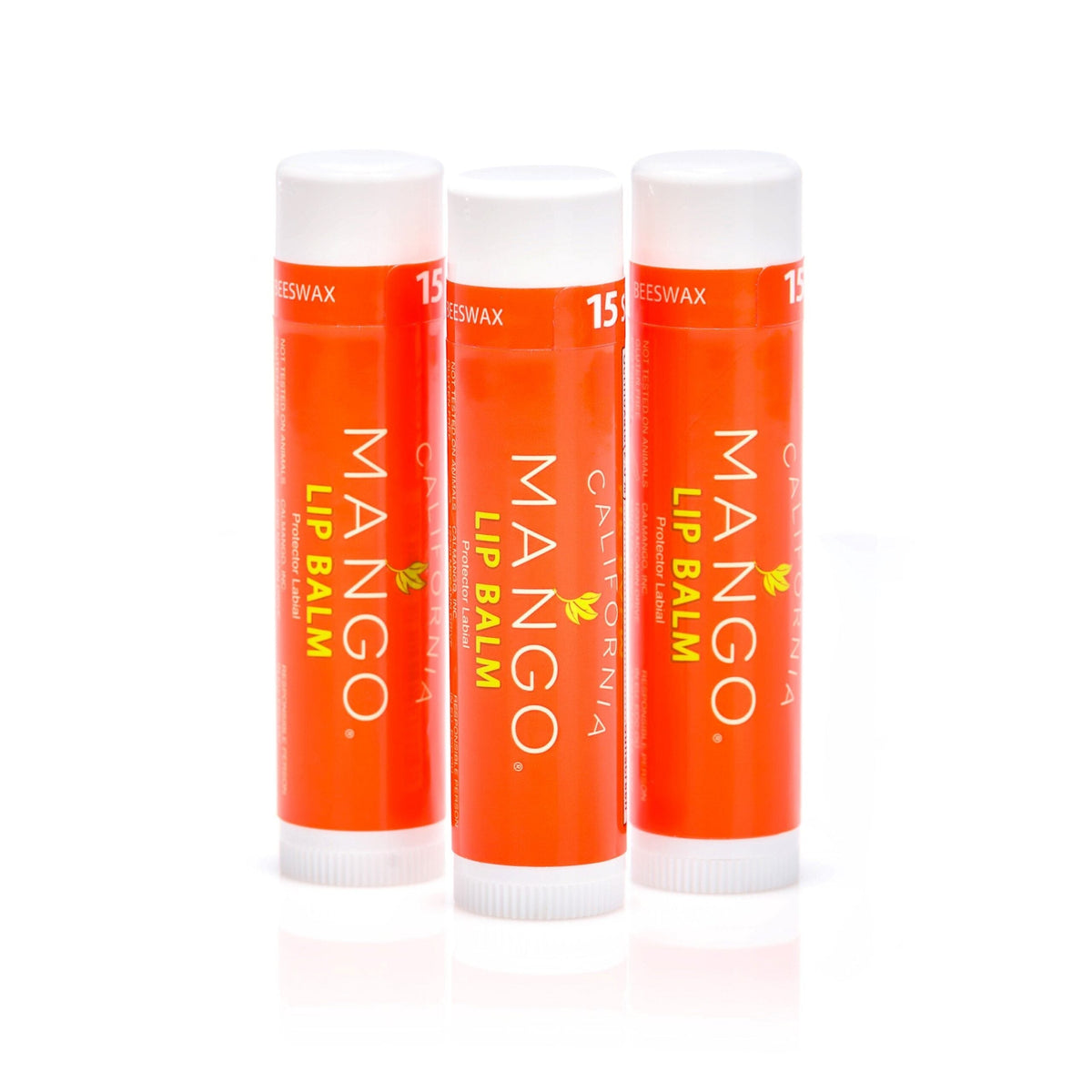Three orange mango lip balm sticks with white caps, SPF 15