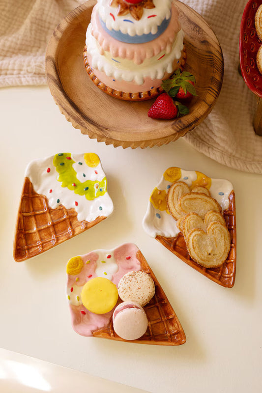 Ceramic ice cream cone snack plate set with four triangular cones and dessert toppings