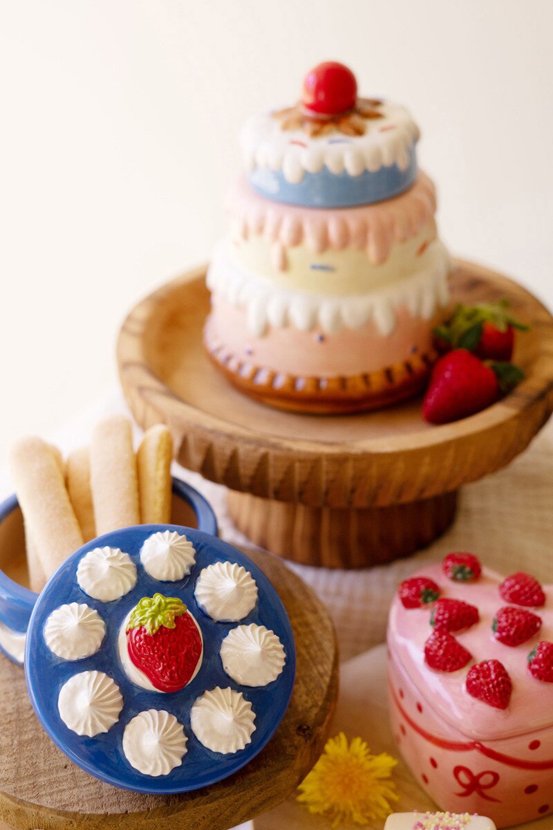 Ceramic tiered cake trinket box on round base, with blue platter and pink strawberry box