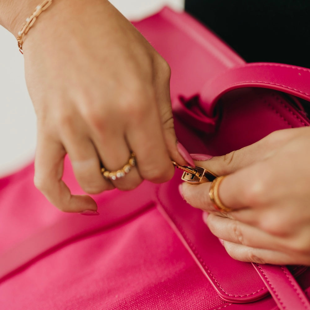 Fuchsia canvas and vegan leather tote lock and clasp hardware detail