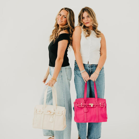 Canvas and vegan leather tote set in black, cream, and fuchsia, front view