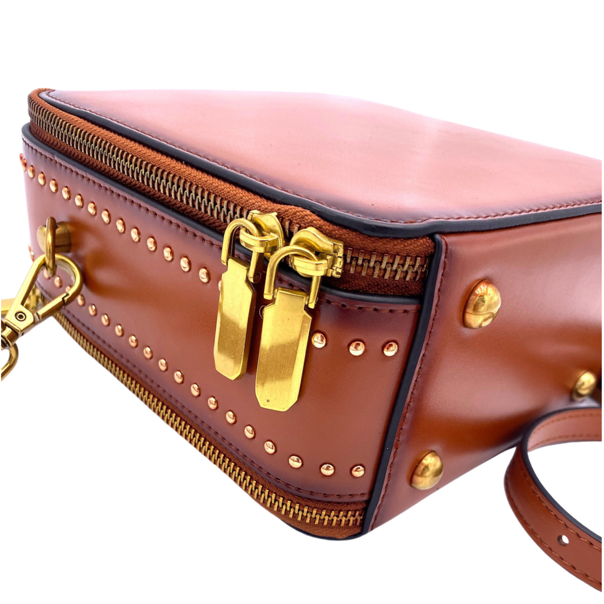 Saddle Camden bag with gold zipper, rivet studs, and front clasp