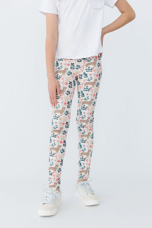 Kids' leggings with pink, green, and tan jungle print, full length