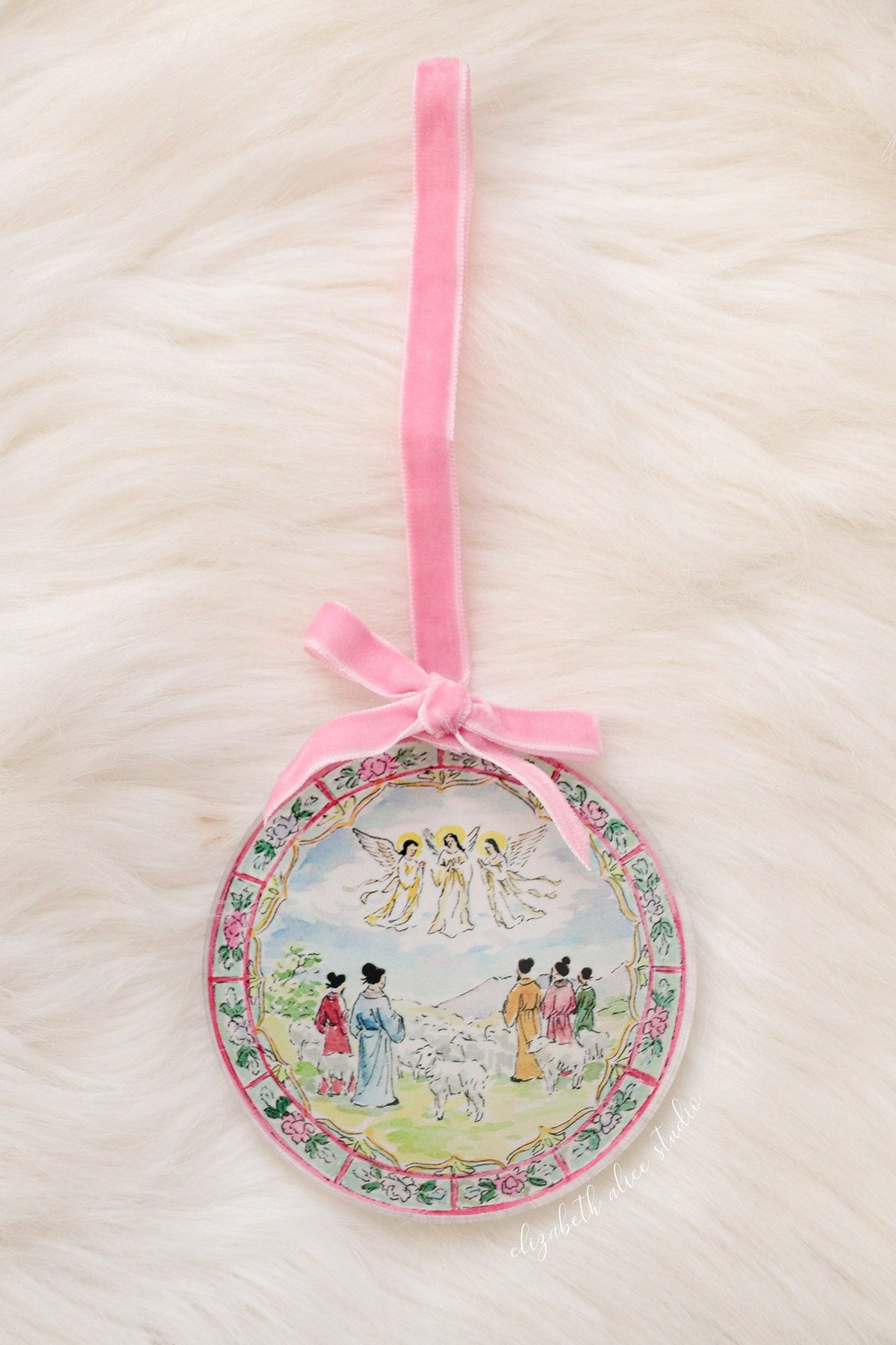 Round shepherds and angels acrylic ornament with pink velvet bow and hanging loop