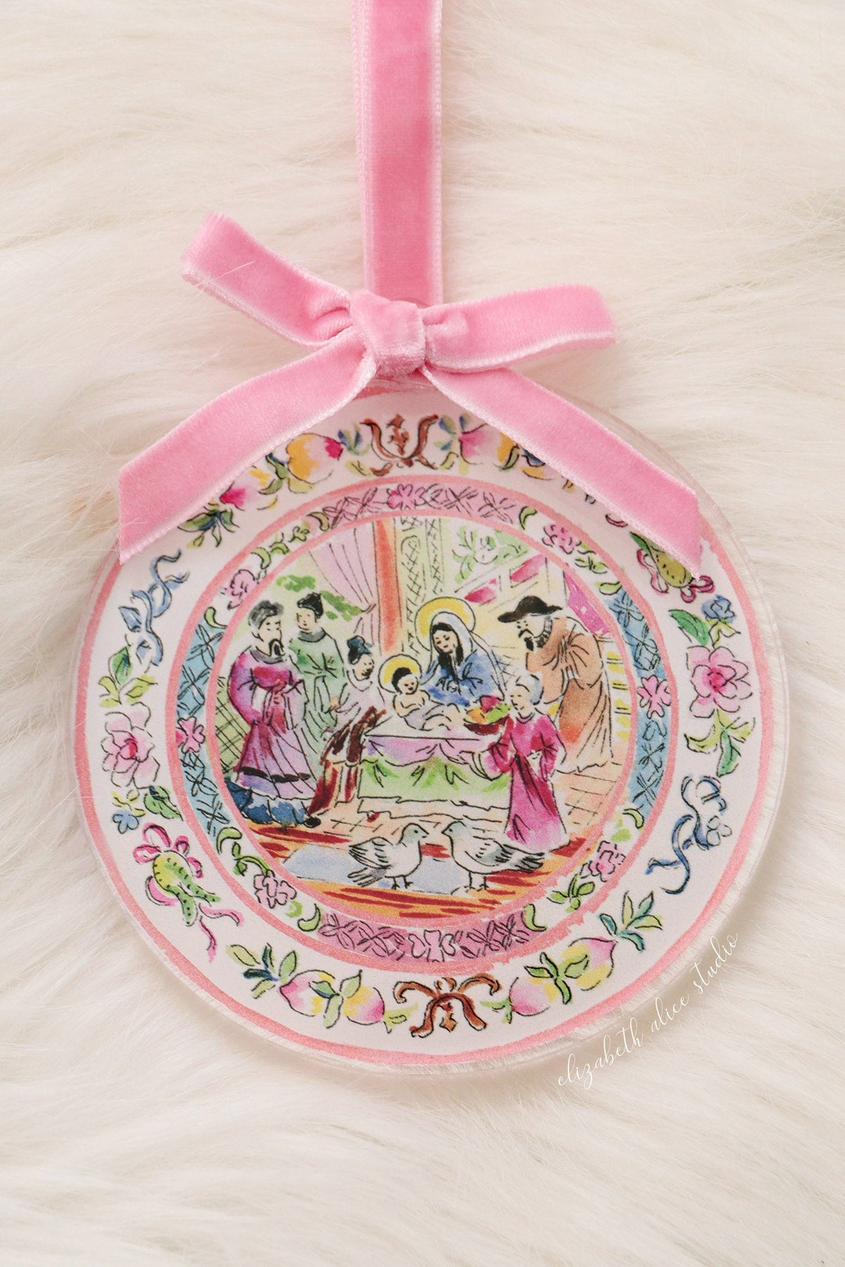 Round acrylic ornament with pink velvet bow and colorful temple scene