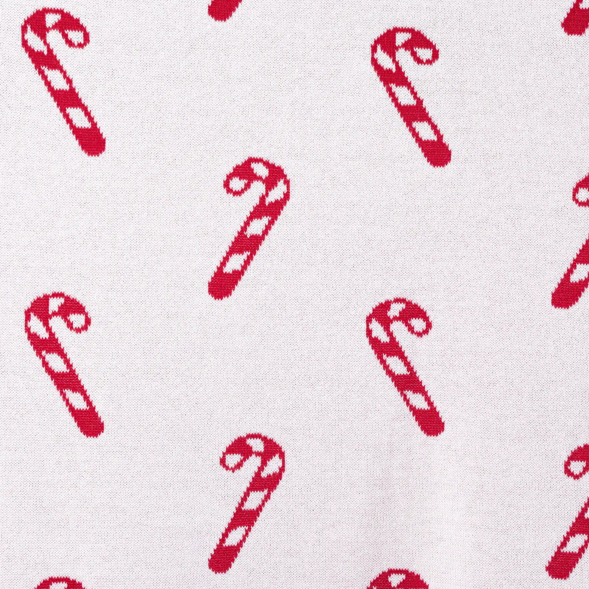 White knit blanket section with red candy cane motif pattern
