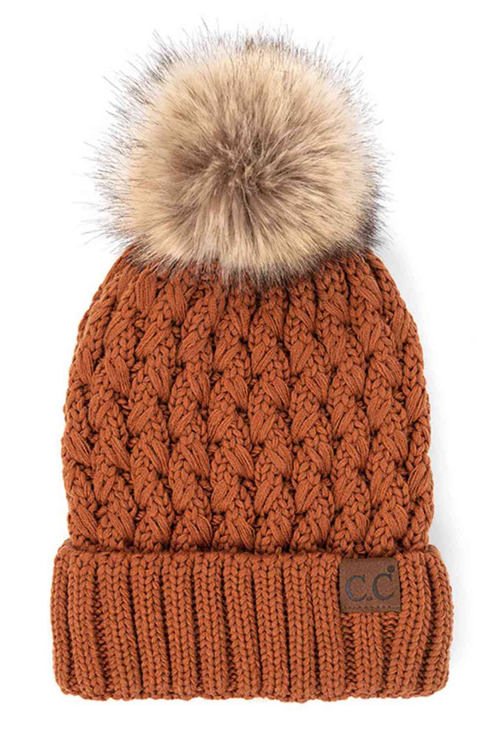 Knit beanie with pom-pom, burnt orange cable knit, ribbed cuff and C.C. label patch