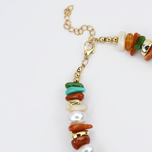 Gold chain end and clasp with white pearls and green, teal, and orange bead accents