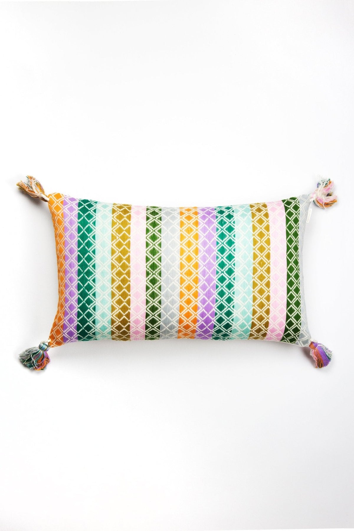 Multi-pattern throw pillow with vertical striped geometry and tassel corner ties
