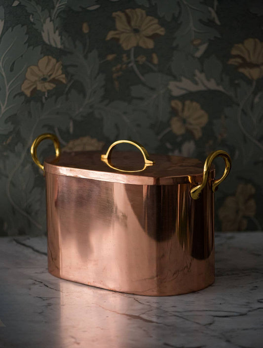 Copper bread box with brass handles and a fitted lid