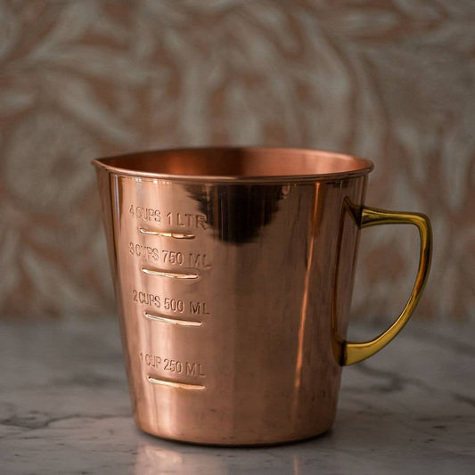Copper liquid measuring cup with handle and 4-cup capacity markings
