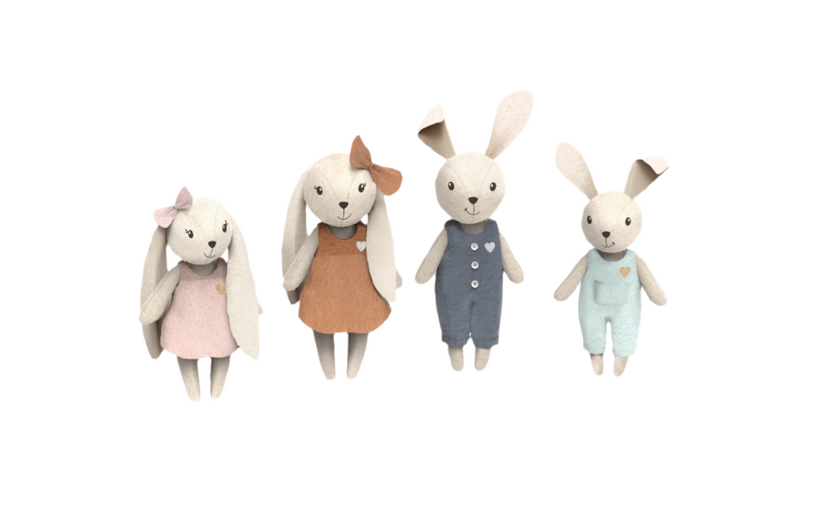 Set of four rabbit plush dolls in pink, blue, brown, and pale outfits