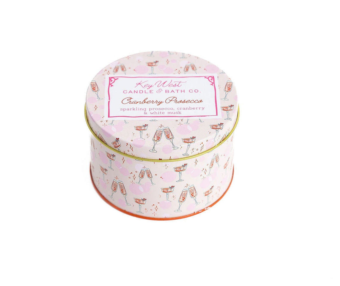 Pink cranberry prosecco travel tin candle with festive drink pattern and lid label