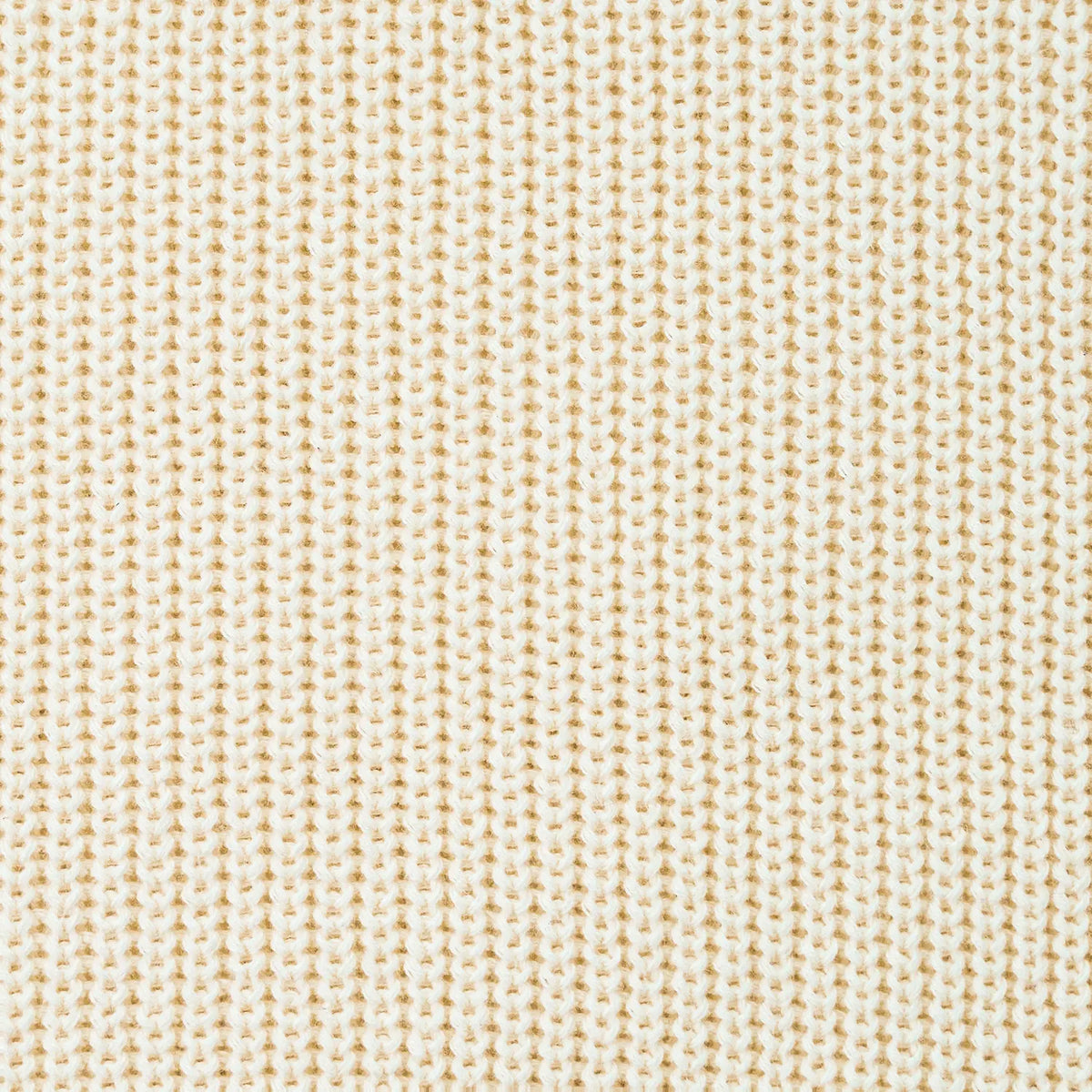 Close-up of cream textured knit fabric on a baby sweater
