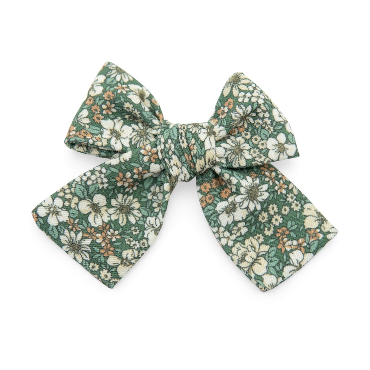 Petite hair bow in green floral fabric with a tied center knot