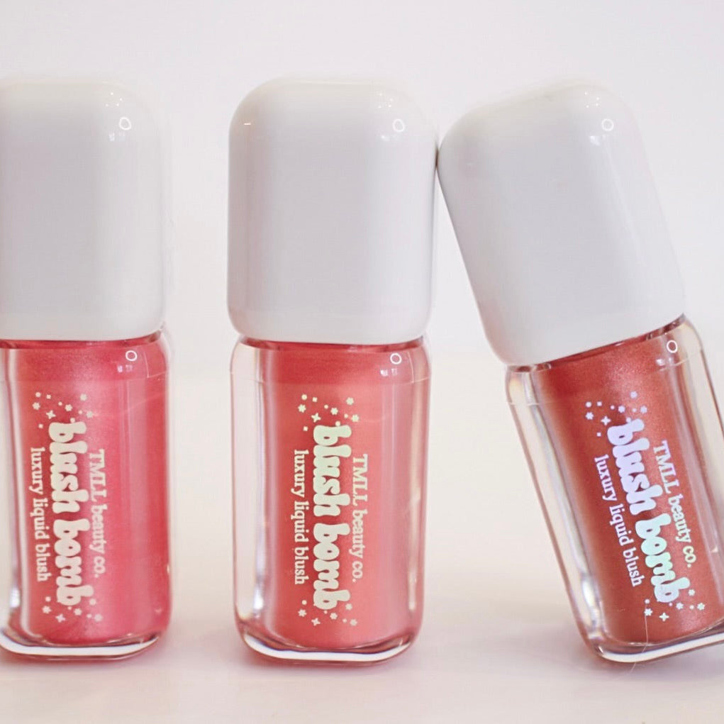 Three liquid blush mini bottles with white caps and red and coral tones.