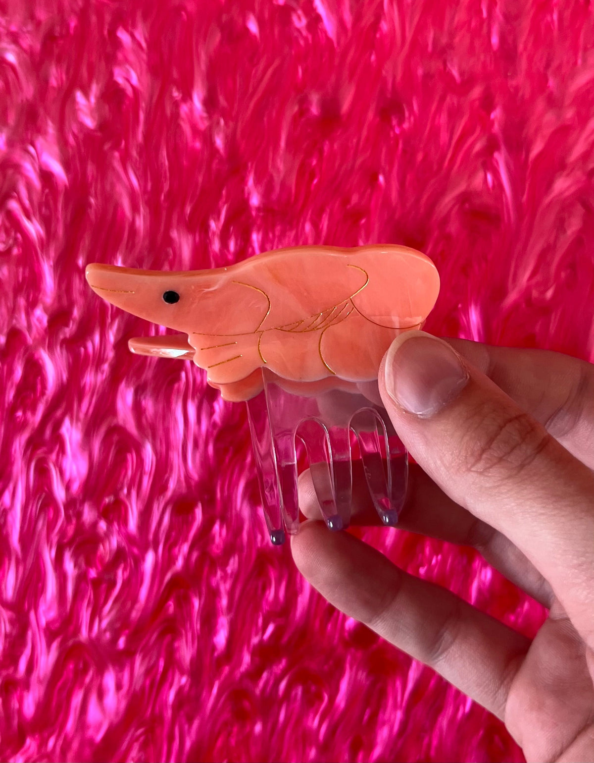 Ocean-themed hair claw shaped like a peach fish with translucent fins