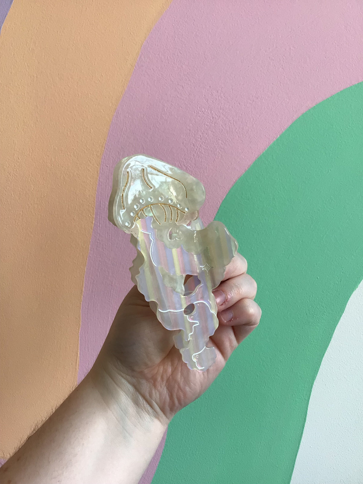 Iridescent jellyfish hair claw with translucent white tentacles