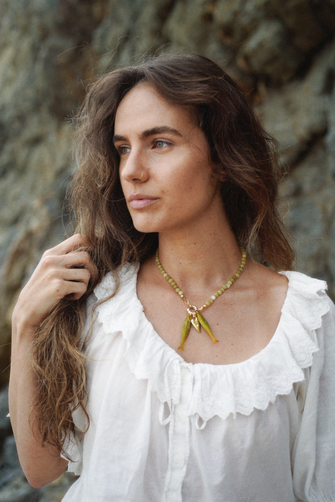 Olive bead fish pendant necklace on model with twin fish charms