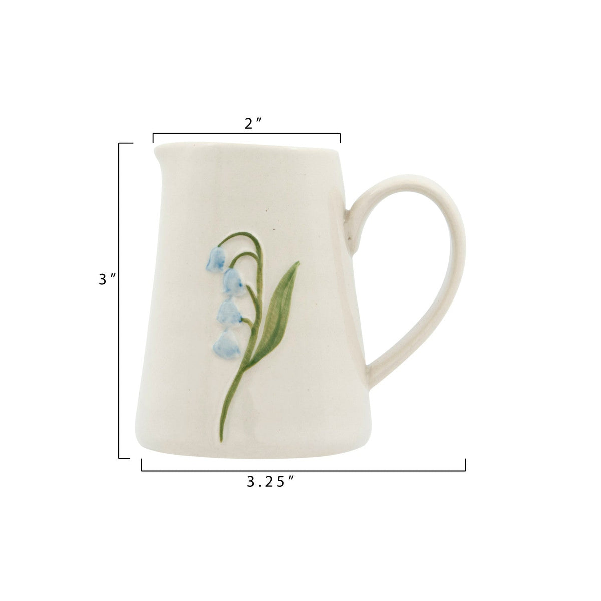 Mini ceramic creamer with blue flower design, about 2 in wide and 3.25 in tall