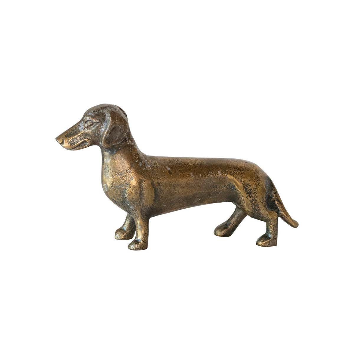 Antique brass dachshund figurine in cast aluminum, side view with tail down.