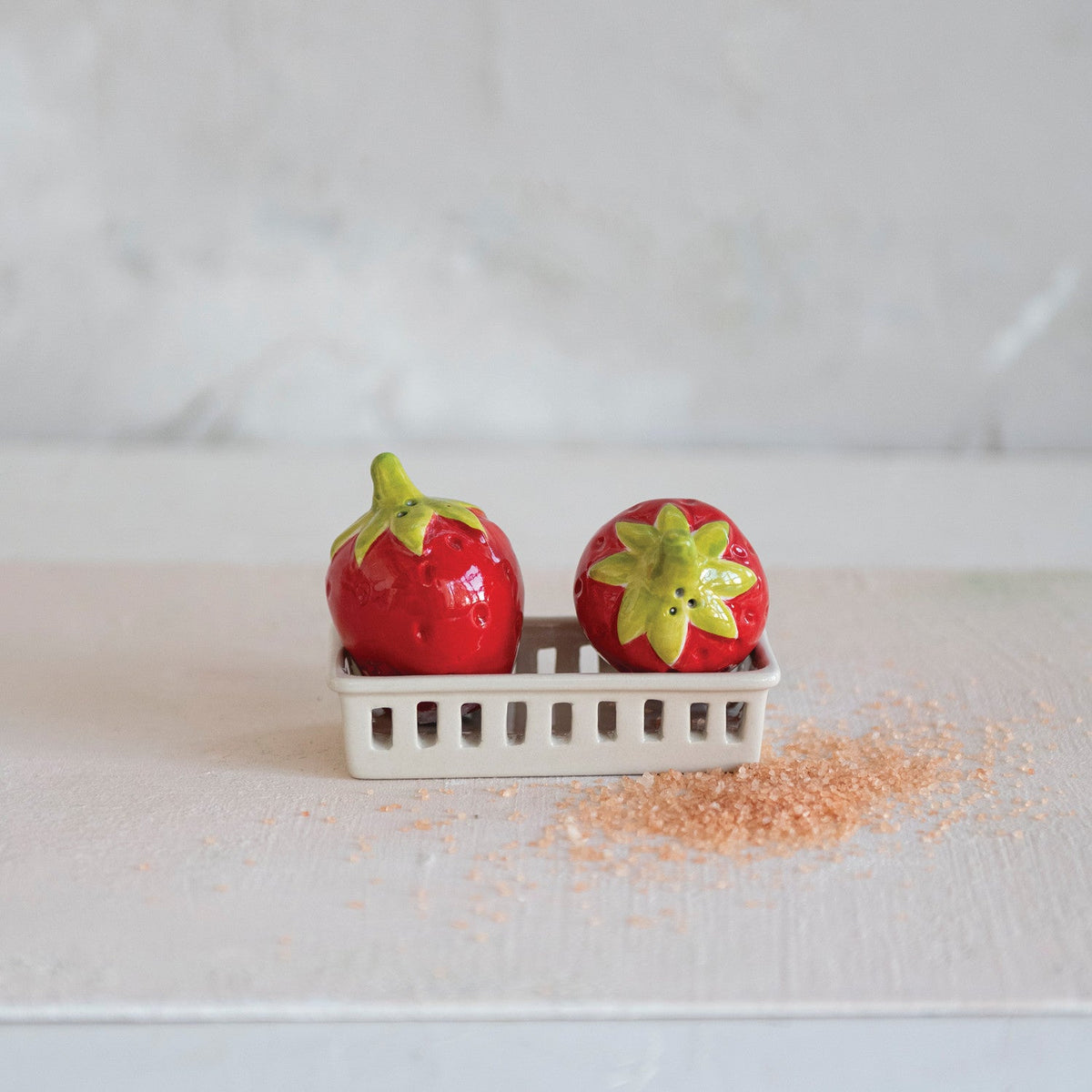 Strawberry salt and pepper shakers in white berry basket holder, two red pieces