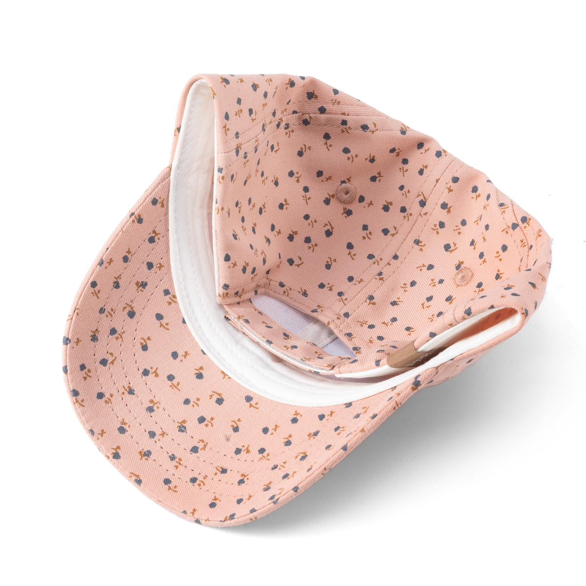 Underside of mauve-pink floral baseball cap with a white inner sweatband