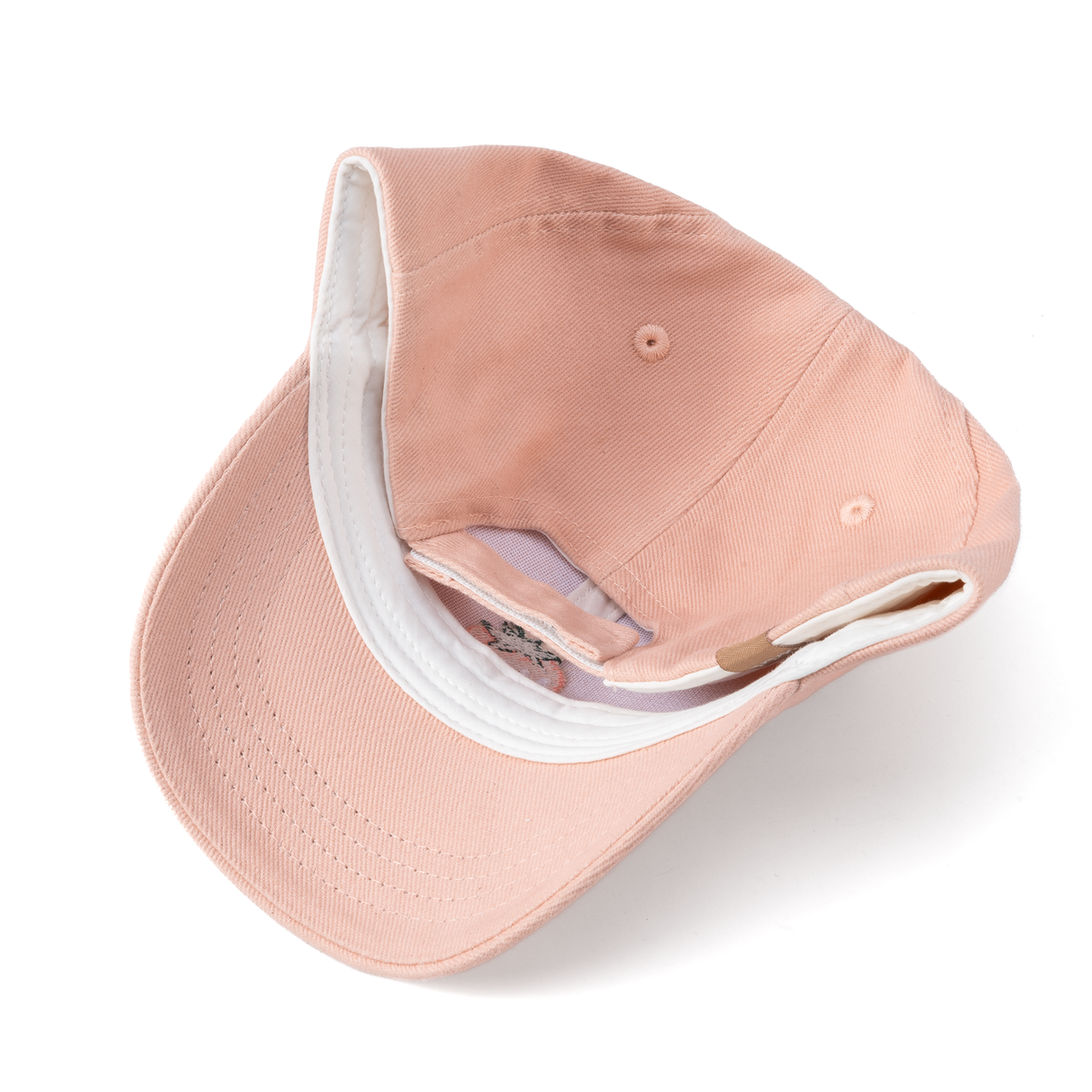Pink baseball cap folded to show its interior and curved brim