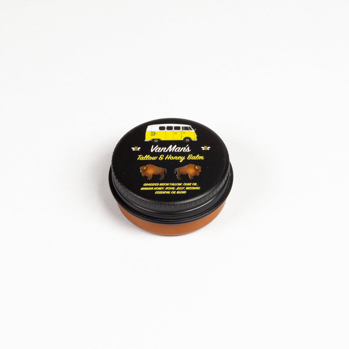 Round black balm tin labeled “Tallow & Honey Balm”