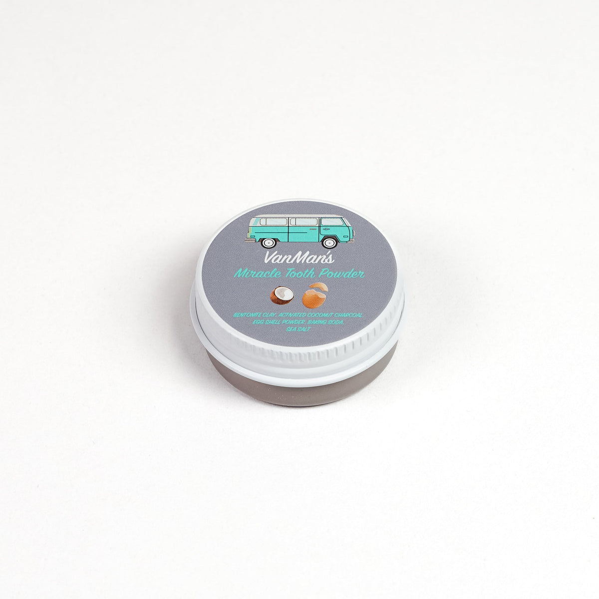 Round tooth powder tin with light gray lid labeled “Mint-Bone Tooth Powder”