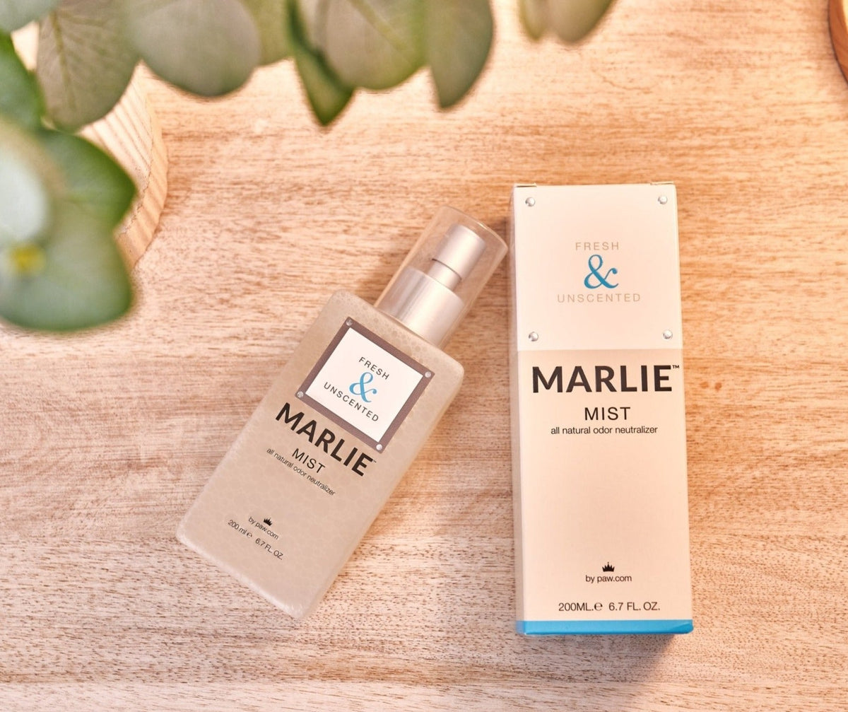 Marlie Fresh & Unscented pet odor eliminator spray bottles on light wood