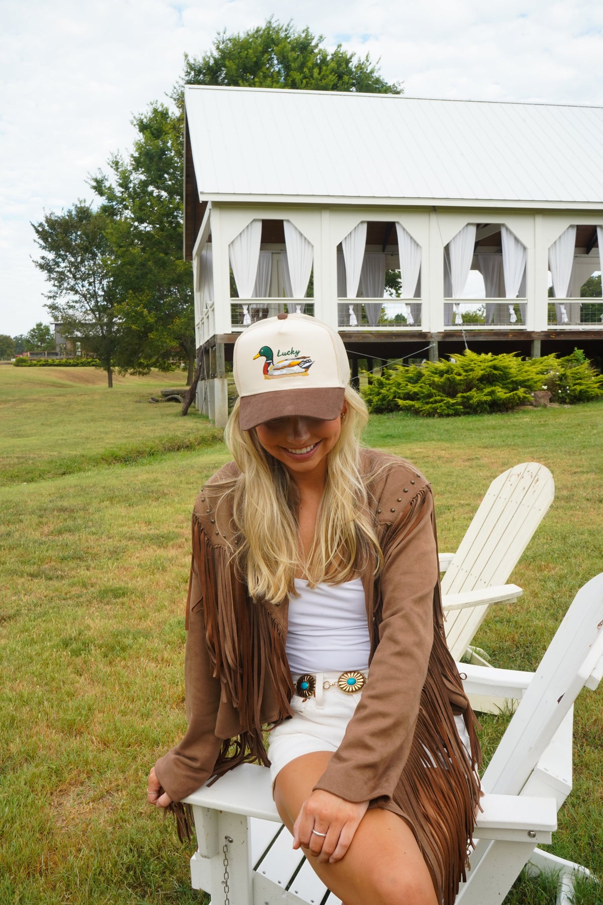 Corduroy trucker hat in brown with white front and duck logo patch.