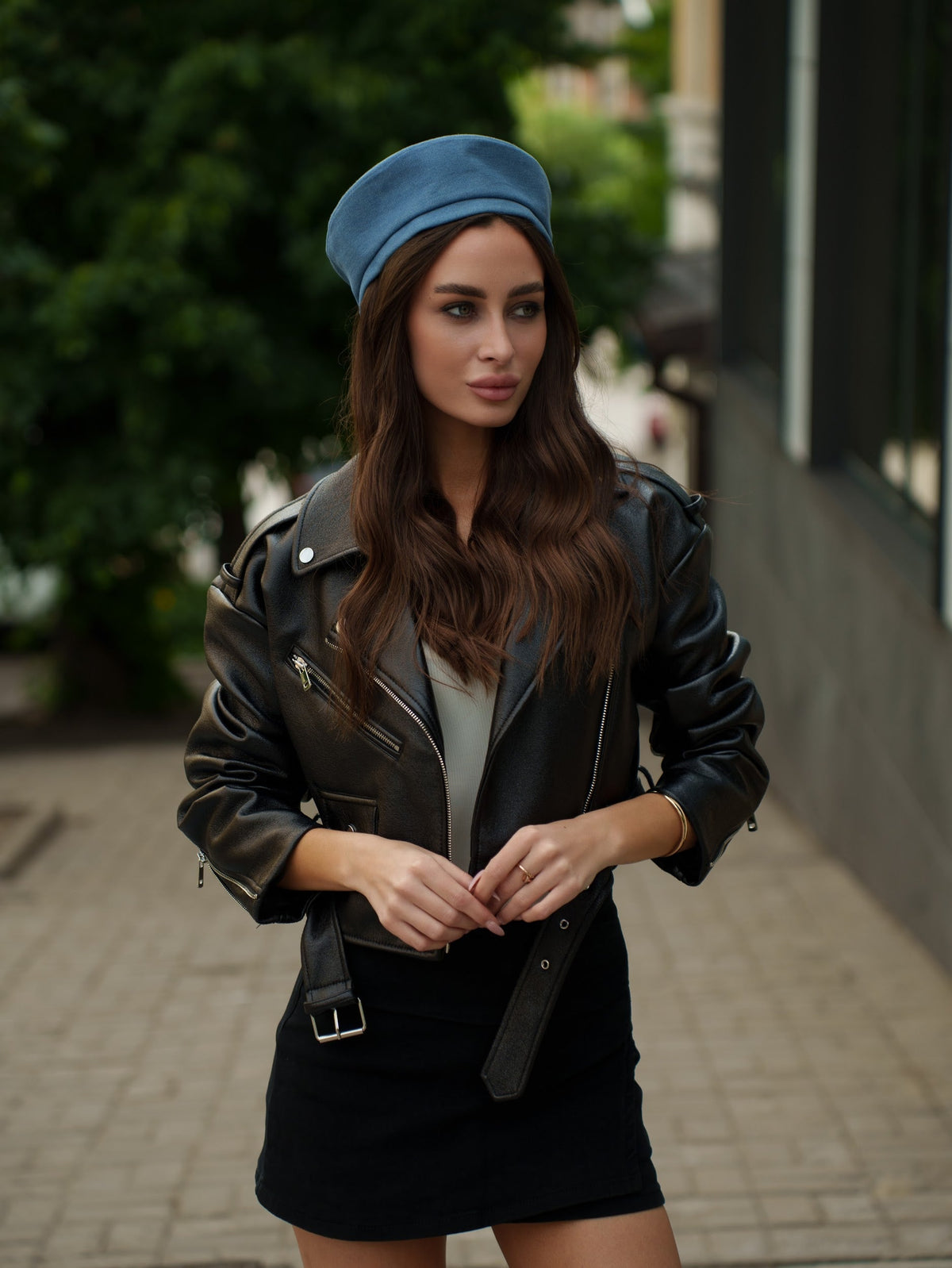 Blue Paris hat with a short brim, shown worn with its rounded crown.