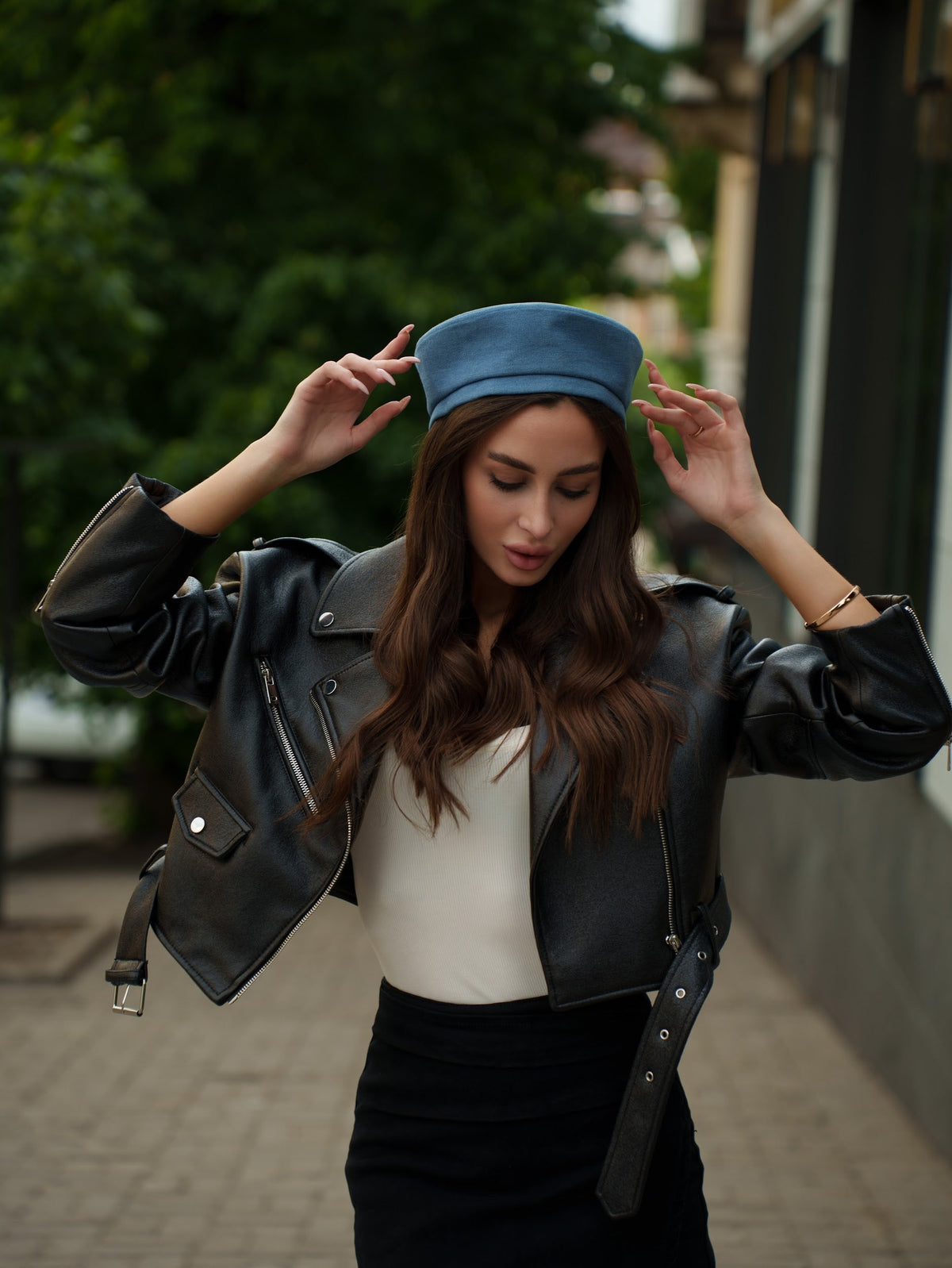Blue Paris hat with a rounded crown and short brim, shown worn from the front.