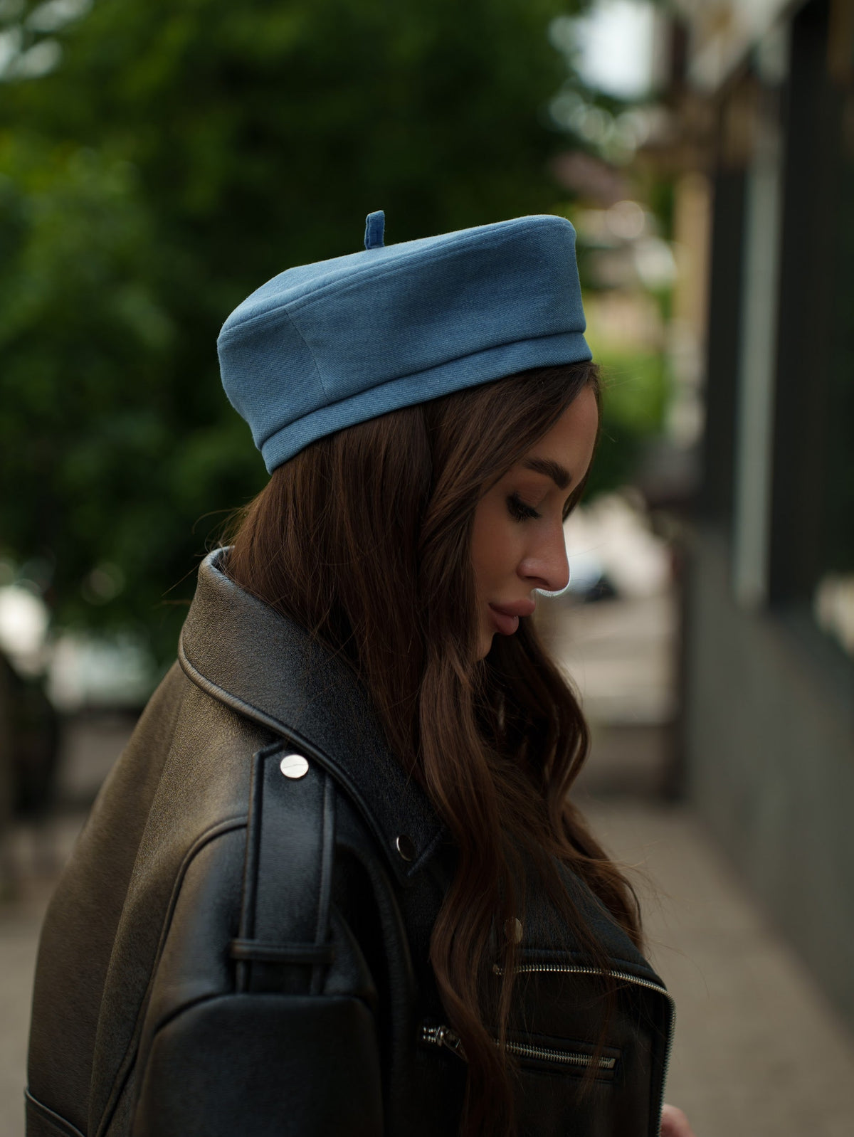 Blue Paris hat shown in profile, with a rounded crown and short brim.