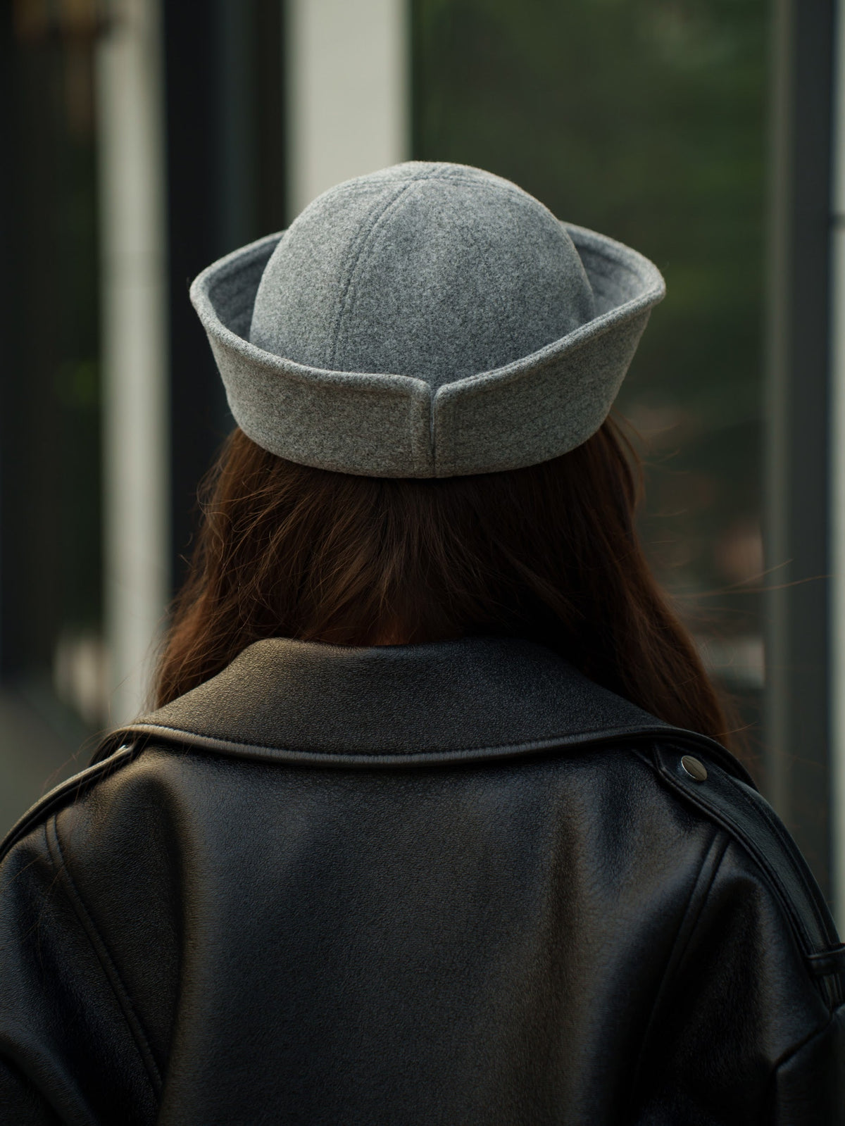Light grey sailor hat shown from behind, with a rounded crown and wide band