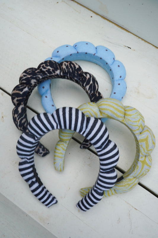 Plush braided headbands with blue scallop, black leopard, and navy-and-white stripes