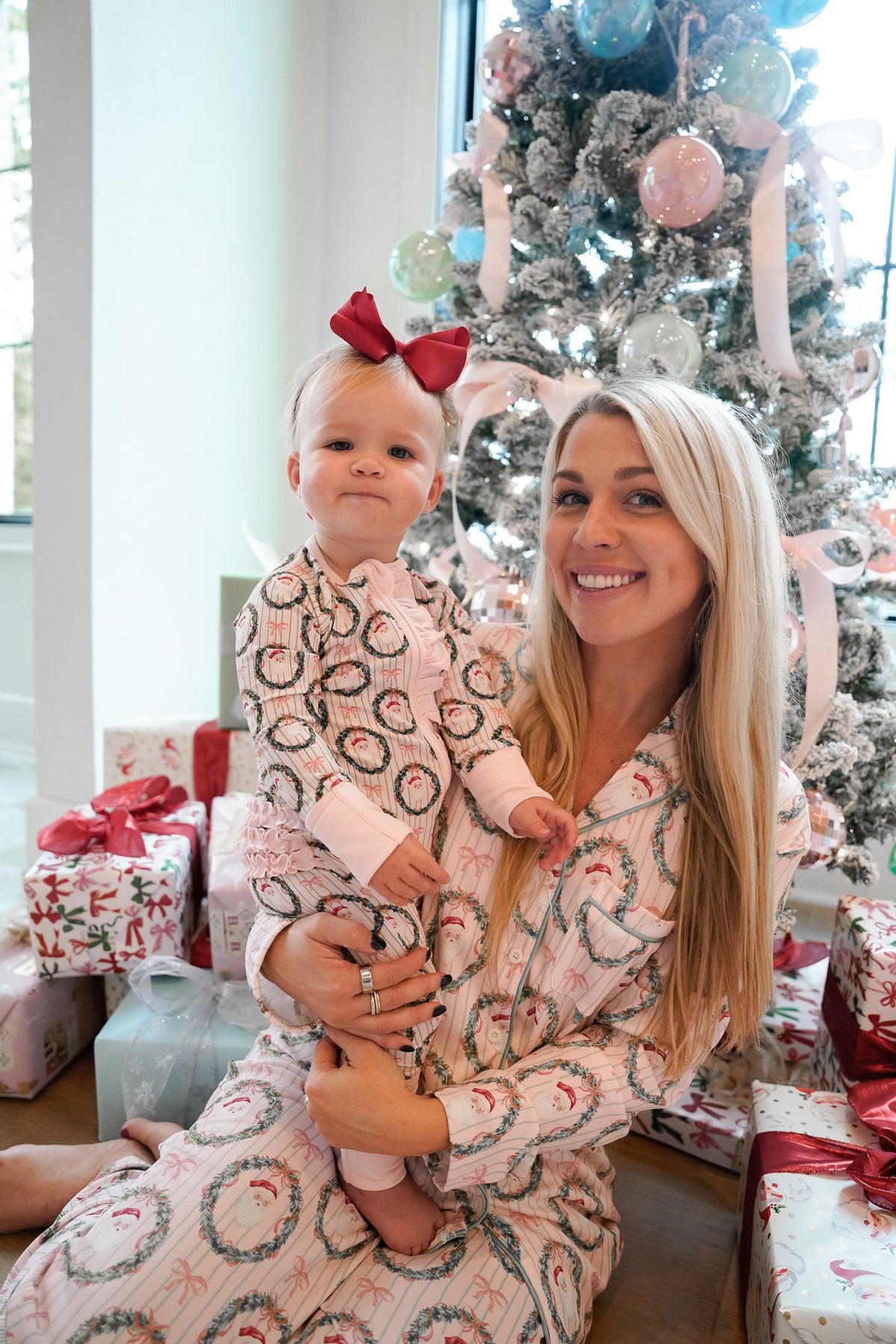 Pink patterned hooded pajama set with long sleeves and matching pants, side view