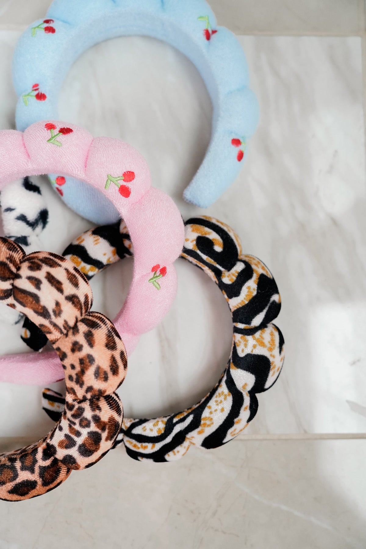 Plush fabric headbands set with blue, pink, leopard-print and zebra-striped loops